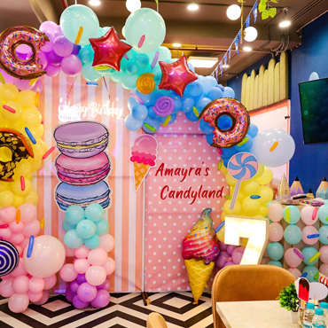 Colourful candy-themed birthday party decoration at Wooray Patna.