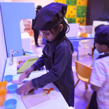 Children enjoying creative activities at a Wooray indoor play area